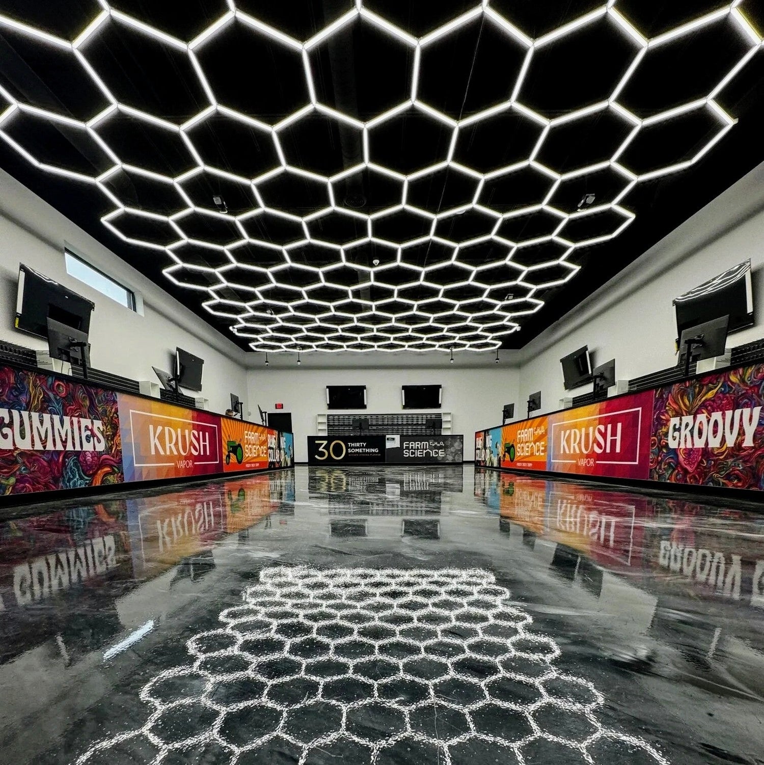 Hex Lighting 5000k 25x45 grid in dispensary with black ceiling and epoxy floors