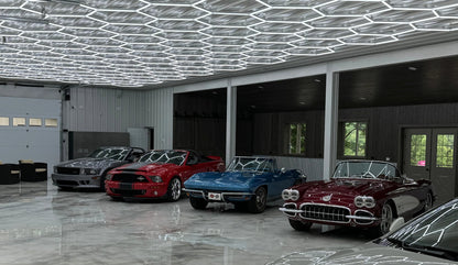 Dimmable hexagon lights over a row of classic cars in a large garage; low voltage 24V with remote control