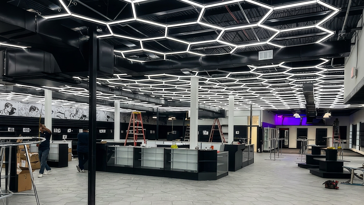 Modern interior with geometric ceiling design and gray flooring