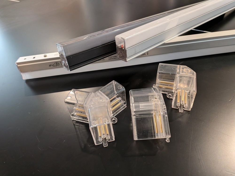Hexagon light bars with clear connectors showing brass contact pins