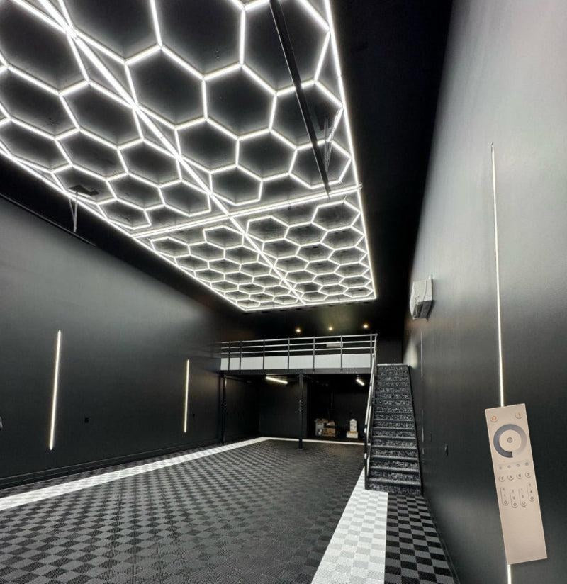 17.8 x 8 ft hexagon light grid in a black garage condo; low voltage 24V, 0-10V dimmable, remote control included