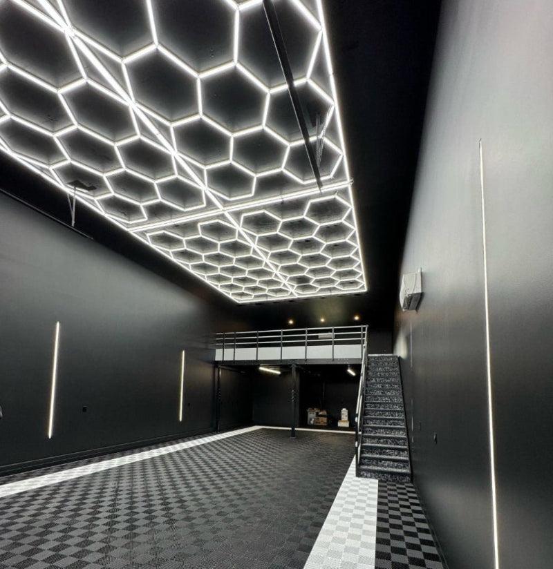 17.8 x 8 ft hexagon light grid in a black garage condo; low voltage 24V, 0-10V dimmable, remote control included