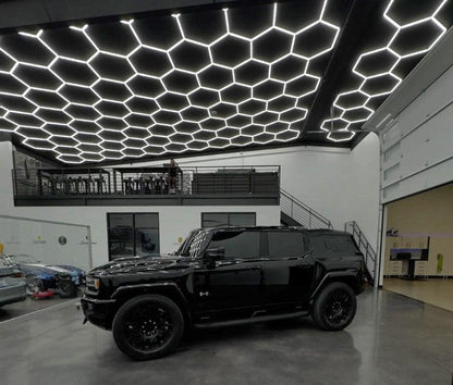 20 x 30 ft hexagon light grid over a black SUV in a garage; low voltage 24V, 0-10V dimmable, remote control included