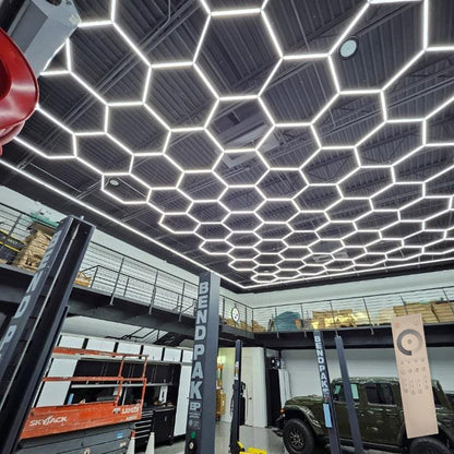 30 x 40 ft hexagon light grid over a shop with car lifts; low voltage 24V, 0-10V dimmable, remote control included