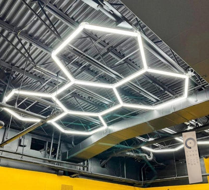 6.8 x 10 ft five-panel hexagon light kit hung from steel ceiling beams; 24V, 0-10V dimmable, remote control included